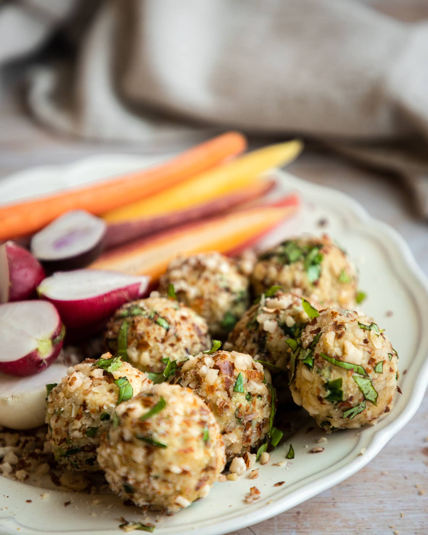Vegan cheese ball with nuts and herbs